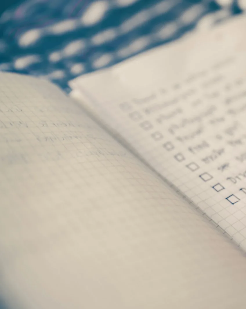 An open notebook with an organised checklist